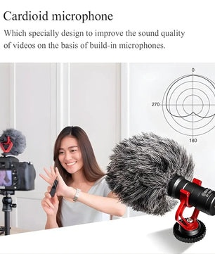 Cardioid microphone with a woman holding it and a camera setup in the background.